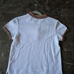 White Burberry polo shirt.